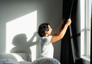 Ensuring full darkness (<5 lux) in bedroom reduces sleep onset latency by ~12% and increases sleep efficiency by ~8%, uplifting mood by promoting melatonin and restfulness.